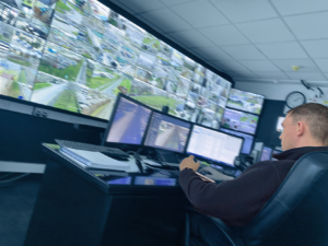 Image of The CCTV Control Room at Birchwood Park in Warrington and a member of the Security Team monitoring the CCTV